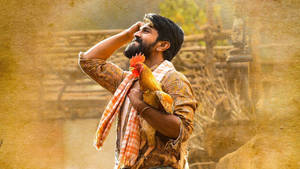 Ram Charan Hd Holding Chicken Wallpaper