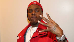 Rapper Dababy Flashing Four Finger Hand-sign Wallpaper