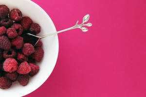 Raspberries On Pink Background Wallpaper