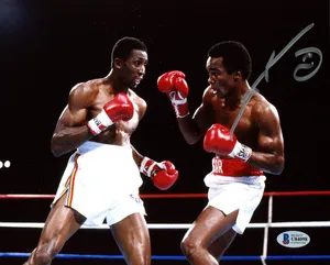 Ray Leonard Boxing And Surrounded By Darkness Wallpaper
