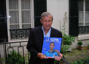 Raymond Kopa Holding Autobiography Wallpaper