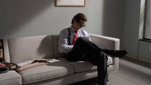 Reading Man On Sofa Wallpaper