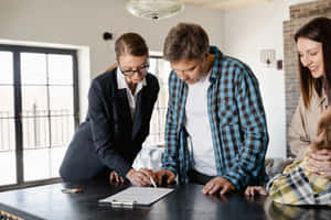 Real Estate Agent Working On A Computer Wallpaper