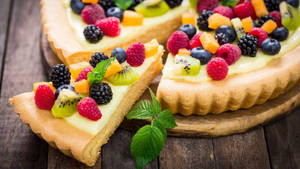 Red And Black Mulberry Fruits On A Cake Wallpaper