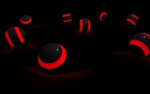 Red And Black Spheres In A Captivating 3d Pattern Wallpaper