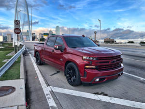 Red Dropped Truck On A Highway Wallpaper