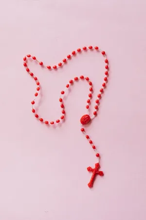 Red Rosary With Jesus On Cross Wallpaper