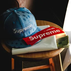 Red Supreme Logo And Cap Wallpaper