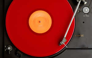 Red Vinyl Record Playing Wallpaper