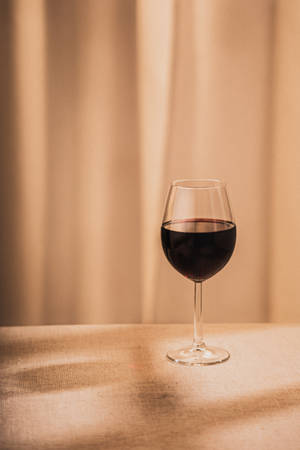 Red Wine On Beige Background Wallpaper