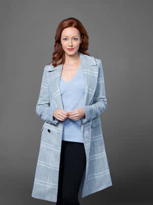 Redheaded Womanin Blue Coat Wallpaper