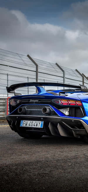 Ride In Style With A Blue Lamborghini Iphone Wallpaper