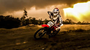 Ride Into Adventure With A Honda Dirt Bike Wallpaper