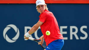 Rising Tennis Star Denis Shapovalov In Action Wallpaper