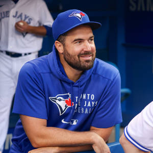 Robbie Ray Smiling At Baseball Benches Wallpaper