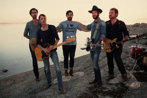 Rock Band At Sunset By The Sea Wallpaper