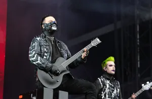 Rock Concert Guitaristsin Action Wallpaper