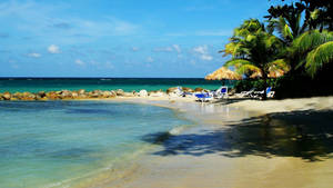 Rocky White-sand Beach In Montego Bay Wallpaper