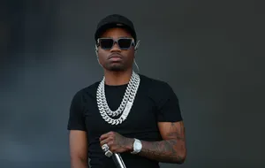 Roddy Ricch Strikes A Pose During An Outdoor Photo Shoot. Wallpaper