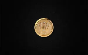 Rolex Logo Crown On A Coin Wallpaper