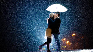 Romantic Couple Kissing In The Rain Wallpaper