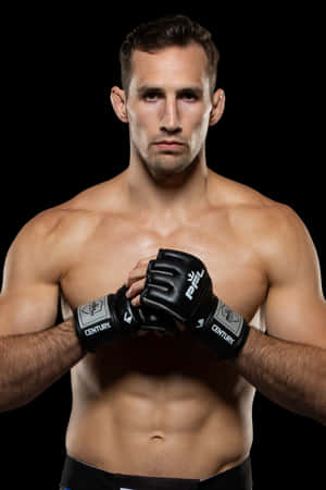 Rory Macdonald – The Mma Champion In Action Wallpaper