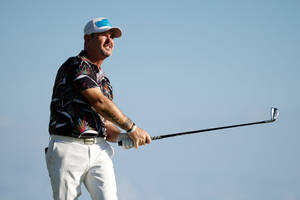 Rory Sabbatini Confidently Holding A Golf Club On The Golf Course Wallpaper