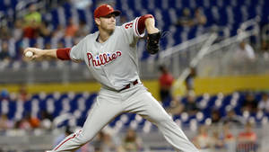 Roy Halladay Throwing Baseball In Stadium Wallpaper