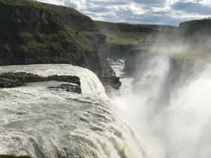 Rushing Gullfoss Waterfall In Southwest Iceland Wallpaper