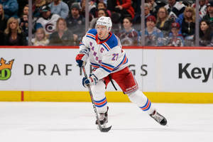 Ryan Mcdonagh New York Rangers Skating Puck Wallpaper