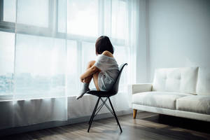 Sad Alone Young Lady In Room Wallpaper