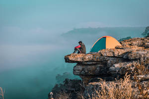 Sad Boy At Mountain Edge Wallpaper