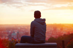 Sad Boy Over Cityscape Wallpaper