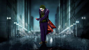Sad Joker Walking With A Card Wallpaper