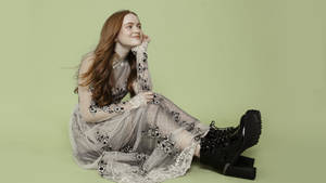 Sadie Sink In Sage Green Backdrop Wallpaper