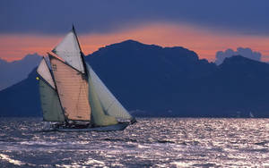 Sailing Schooner Against Mountain Wallpaper