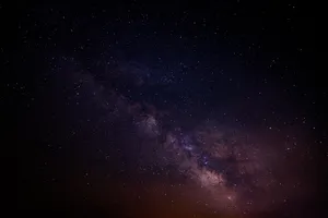 Samsung Galaxy S10 Plus On A Desk Wallpaper