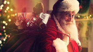 Santa Claus With Present Bag Wallpaper