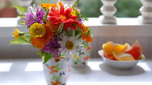 Scenic Display Of Fresh Flowers In Elegant Vase Wallpaper