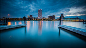 Scenic View Of Milwaukee Skyline Against Tranquil Lake Michigan Wallpaper