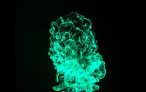 Scorching Green Fire In Black Wallpaper