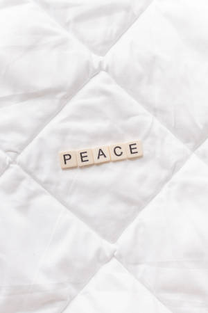 Scrabble Tiles Spelled In Peace Wallpaper