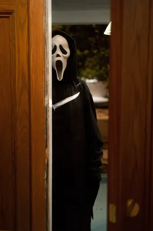 Scream Ghostface Behind Door Wallpaper