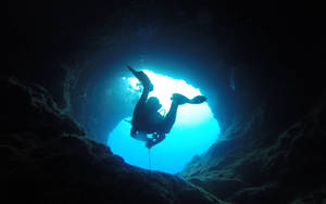 Scuba Diver Swimming Underwater Cave Wallpaper