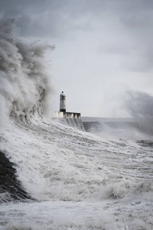 Sea Storm Waves Near Lighthouse Wallpaper