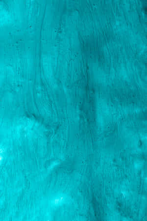 Seamless Integration Of Style And Technology With The Turquoise Iphone Wallpaper