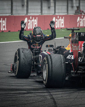 Sebastian Vettel Kneeling On The Track Wallpaper