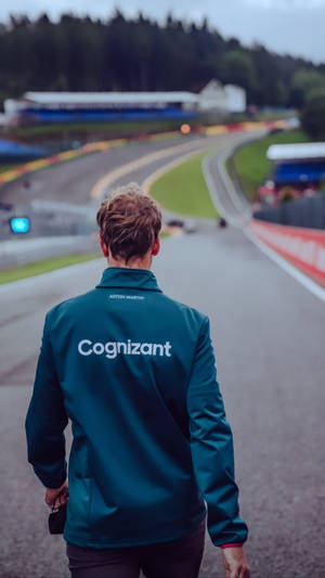 Sebastian Vettel Strolling On The Race Track Wallpaper