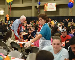 Senator John Cornyn Serving Food Wallpaper