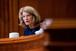 Senator Lisa Murkowski, Looking Serious During A Public Event Wallpaper